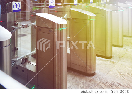 Turnstiles in the subway. Access system of public transport in the city. Urban image. 59618008
