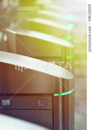 Turnstiles in the subway. Access system of public transport in the city. Urban image. 59618009
