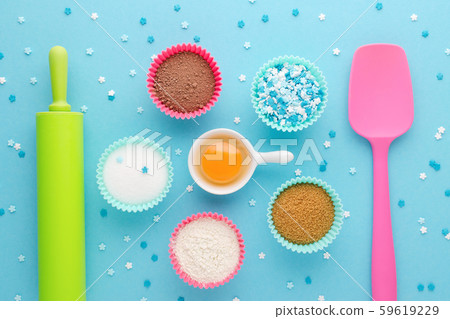 ingredients for baking and kitchen tools on blue background, flat lay ingredients for baking and kitchen tools on blue background, flat lay 59619229