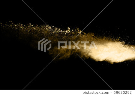 Golden powder explosion on black background. Freeze motion.  59620292