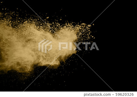 Golden powder explosion on black background. Freeze motion.  59620326