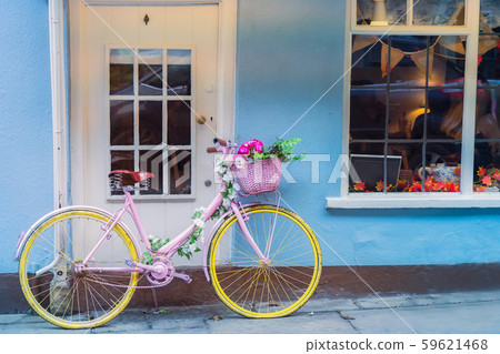 Hipster retro yellow bicycle with flower basket Hipster retro yellow bicycle with flower basket 59621468