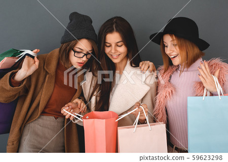 Young girls teenagers friends together shopping concept 59623298