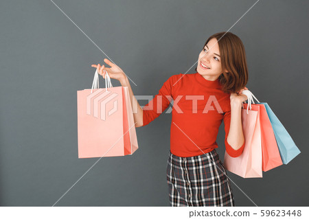 Young girl teenager isolated portrait shopping concept 59623448