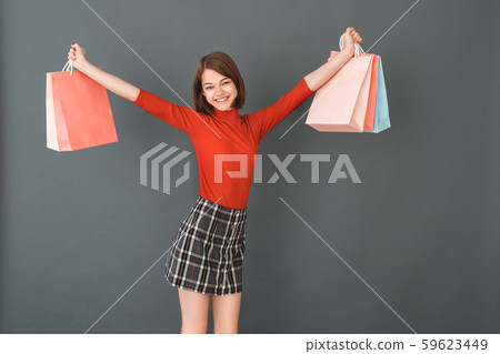 Young girl teenager isolated portrait shopping concept 59623449