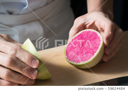 In front of board cutting red radish In front of board cutting red radish 59624484