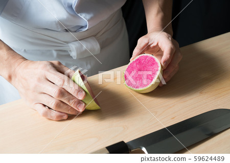 In front of board cutting red radish In front of board cutting red radish 59624489
