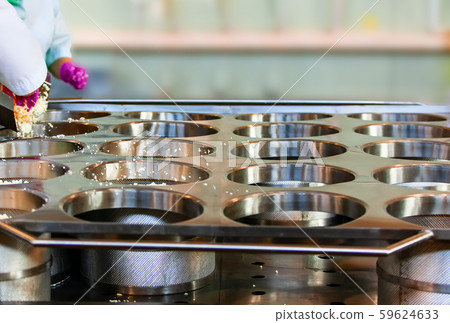 Making delicious cheese at a cheese factory 59624633