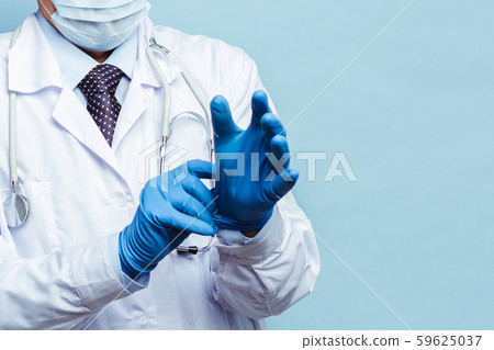 doctor puts on rubber gloves, healthcare and medicine. Isolate on blue background doctor puts on rubber gloves, healthcare and medicine. Isolate on blue background 59625037