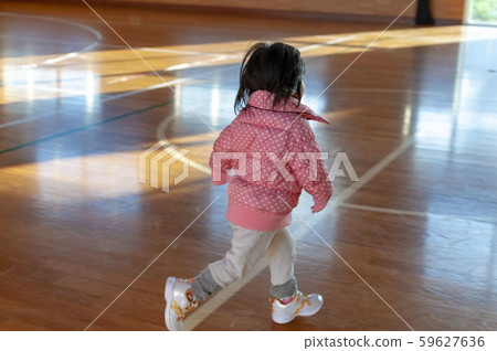 Kids running in the gym at dusk Kids running in the gym at dusk 59627636