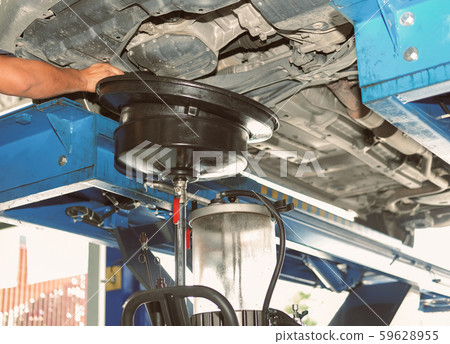 vehicle lift up by hydraulic for motor oil change 59628955