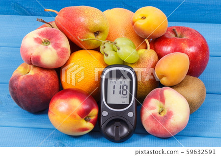 Glucometer and fresh natural fruits 59632591