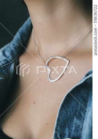 Tender jewerly on female neck, close up shot Tender jewerly on female neck, close up shot 59636722