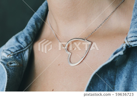 Tender jewerly on female neck, close up shot Tender jewerly on female neck, close up shot 59636723