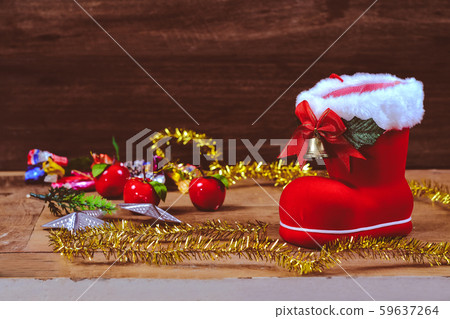 Red boot christmas or Santa's shoe on rustic Red boot christmas or Santa's shoe on rustic 59637264