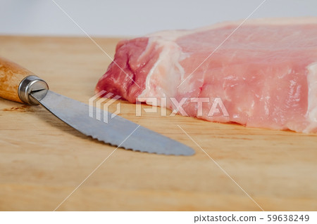 Uncooked fresh pock meat on cutting wood board 59638249