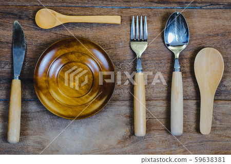 wooden surface and a wooden spoon and fork on wood wooden surface and a wooden spoon and fork on wood 59638381