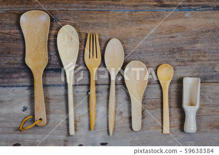 wooden surface and a wooden spoon and fork on wood wooden surface and a wooden spoon and fork on wood 59638384