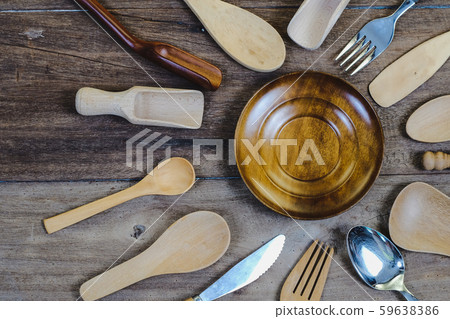 wooden surface and a wooden spoon and fork on wood wooden surface and a wooden spoon and fork on wood 59638386