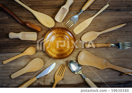 wooden surface and a wooden spoon and fork on wood wooden surface and a wooden spoon and fork on wood 59638388