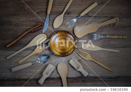wooden surface and a wooden spoon and fork on wood wooden surface and a wooden spoon and fork on wood 59638390