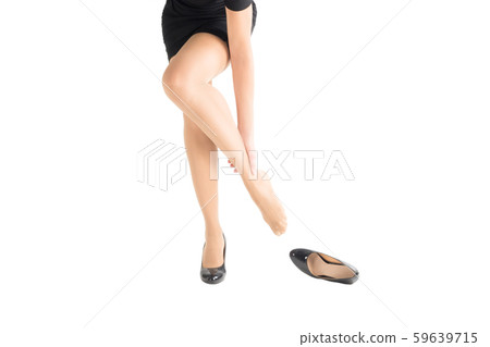 Female lower body, woman take off her high heels tight shoe and mass her weary bare foot. Female lower body, woman take off her high heels tight shoe and mass her weary bare foot. 59639715