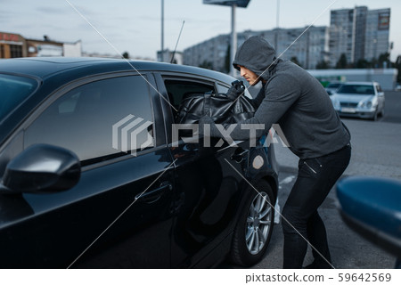 Car thief breaking door, criminal job, burglar Car thief breaking door, criminal job, burglar 59642569