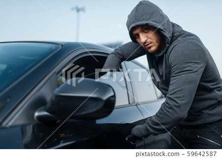 Car thief breaking door, criminal job, burglar Car thief breaking door, criminal job, burglar 59642587