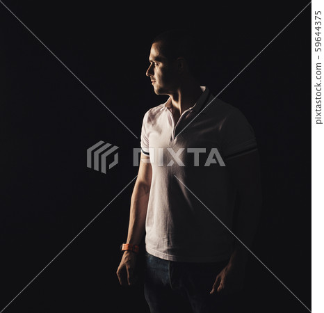 Adult man looking away at black background 59644375