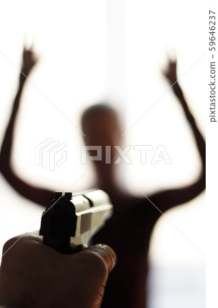 A criminal threatens a young girl with a gun A criminal threatens a young girl with a gun 59646237