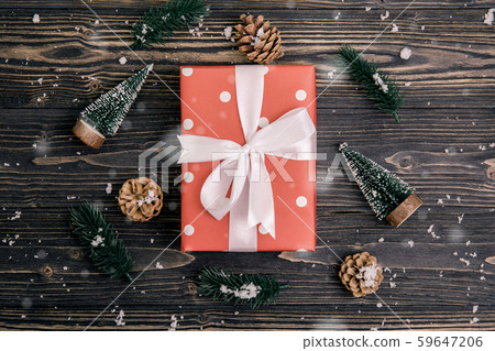 Christmas holiday composition with red gift box and tag decoration on wooden background 59647206