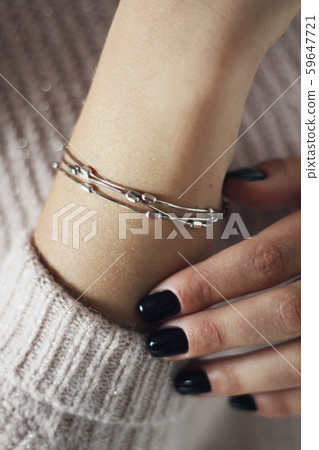 Tender jewerly on female hand, close up shot Tender jewerly on female hand, close up shot 59647721