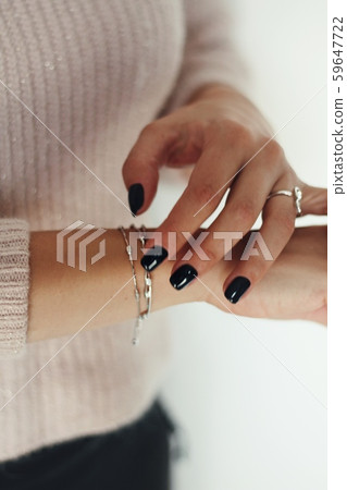 Tender jewerly on female hand, close up shot Tender jewerly on female hand, close up shot 59647722
