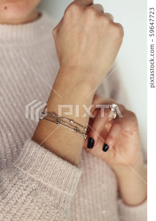 Tender jewerly on female hand, close up shot Tender jewerly on female hand, close up shot 59647723