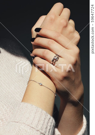 Tender jewerly on female hand, close up shot Tender jewerly on female hand, close up shot 59647724