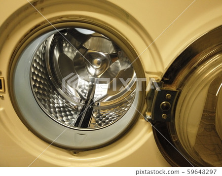 Laundromat with open door and shiny drum. Laundromat with open door and shiny drum. 59648297