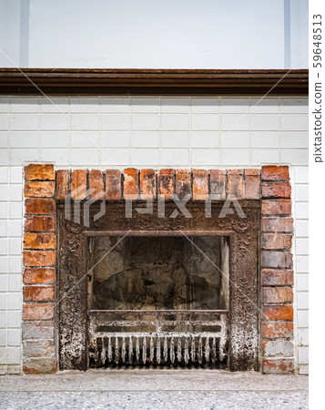 An old brick stove in a village house. 59648513