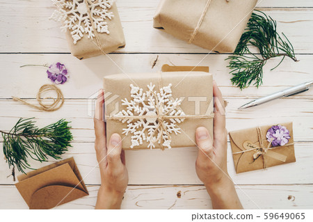 Close up of hands woman present gift box on wooden Close up of hands woman present gift box on wooden 59649065