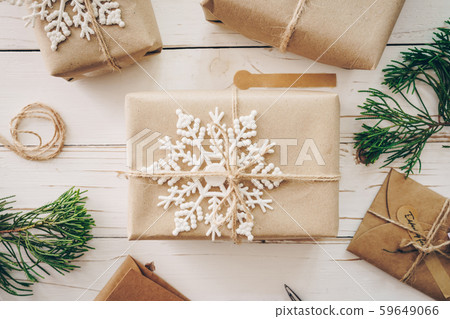 Top view of gift box and christmas card on wooden Top view of gift box and christmas card on wooden 59649066