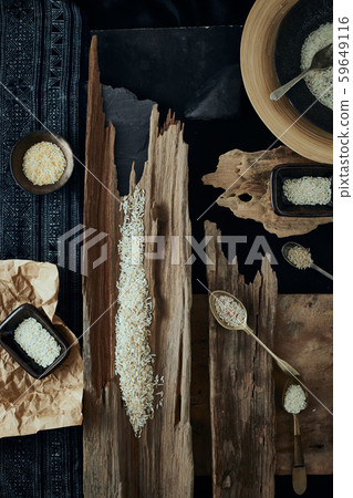 Rice of different varieties on wooden background. Rice of different varieties on wooden background. 59649116