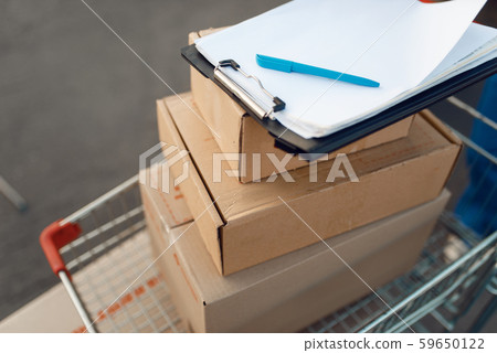 Parcel boxes in cargo cart, delivery service Parcel boxes in cargo cart, delivery service 59650122