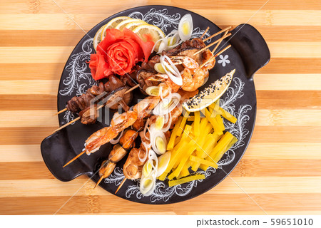 Assorted shrimp and shiitake mushrooms, mussels, and sweet potato. 59651010