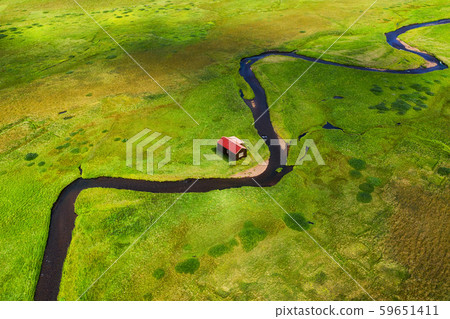 Iceland. Aerial view on the alone house, field and river. Landscape in the Iceland at the day time. Iceland. Aerial view on the alone house, field and river. Landscape in the Iceland at the day time. 59651411