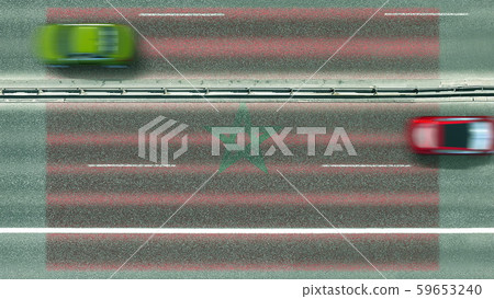 Aerial top down view of cars revealing flag of Morocco on the road. Traveling related conceptual 3D Aerial top down view of cars revealing flag of Morocco on the road. Traveling related conceptual 3D 59653240