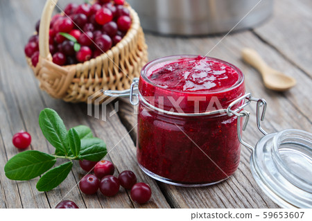 Jar of crushed cranberries for sauce or jam. 59653607
