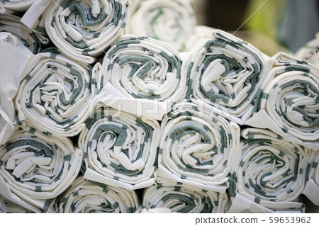 Roll the fabric folded beautifully in the textile shop. Roll the fabric folded beautifully in the textile shop. 59653962