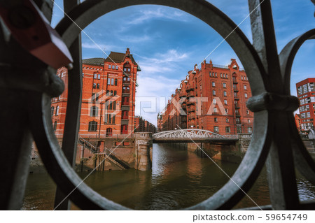 Speicherstadt warehouse district in Hamburg, Germany, Europe. Old brick buildings and channel of 59654749