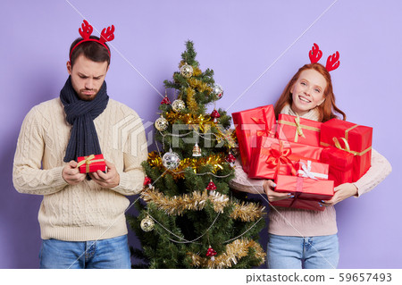 Young couple exchanging gifts 59657493