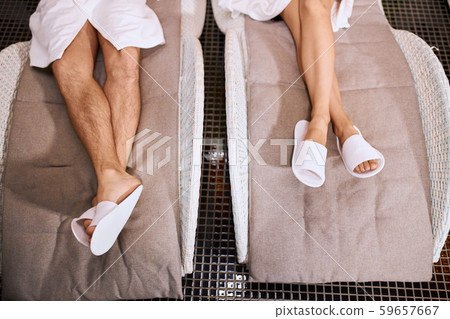 Legs of people wearing slippers Legs of people wearing slippers 59657667
