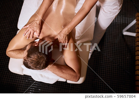 Man has deep tissue massage on the back 59657804